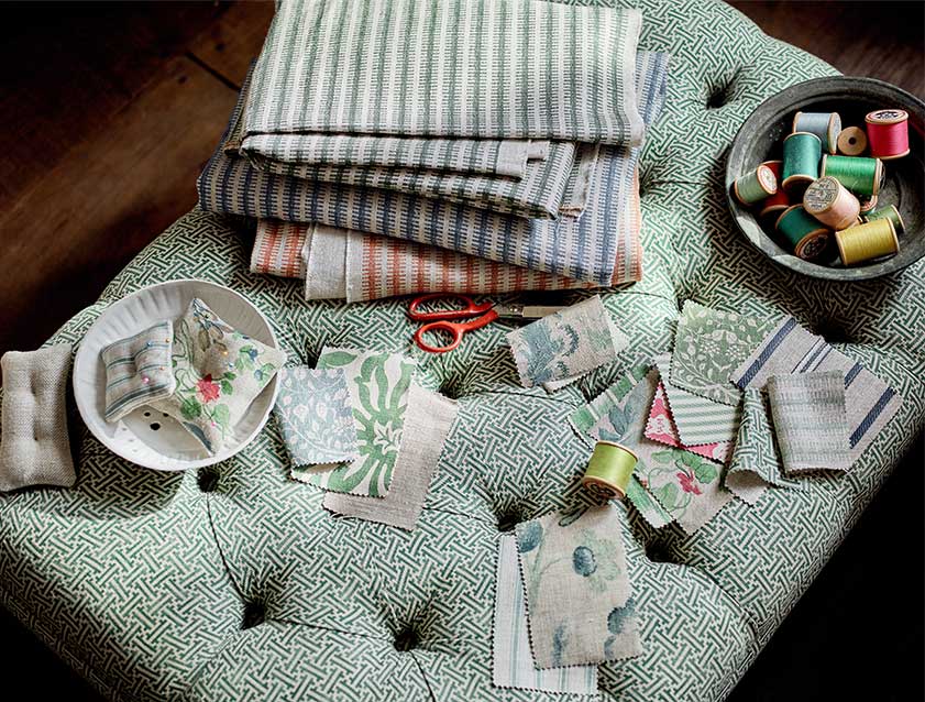 Bedham footstool in Spill Resistant RHS Lattice Green with other exclusive fabrics